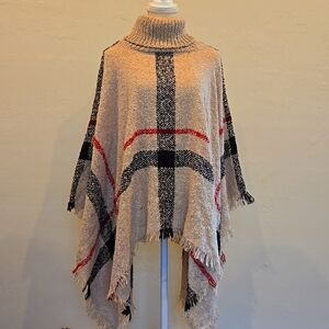 Plaid Tan turtleneck chunky knit cape style sweater. familiar iconic print. …